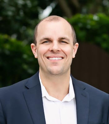 Portrait of Brandon Reinhardt, Realtor Associate.